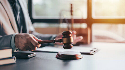 Justice and Law Concept with Gavel in Hand of Adult Man. Legal Judgement and Court Decision Lawyer...