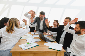 Business team celebrating success during office meeting