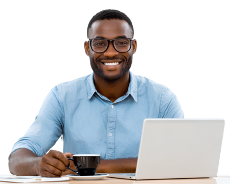 A happy Middle Eastern man in a blue shirt sitting at his desk with a laptop and a coffee cup - Powered by Adobe