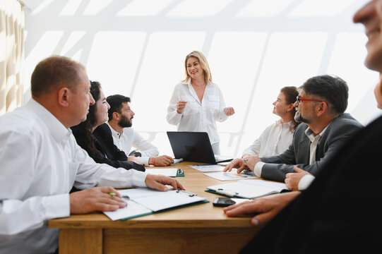 Business team meeting, female leader inspiring her colleagues