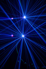 Blue and purple beams in dark background.
