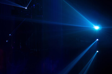 Blue beams in dark background.