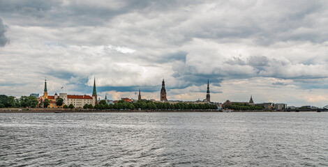Fototapeta premium Riga Old Town cityscape. View over the Daugava River to Riga, the capital of Latvia. Riga church towers