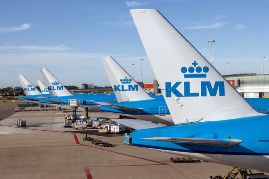 AMSTERDAM, NETHERLANDS, JULY 03 2025, Row of KLM aircraft parked at an airport terminal
