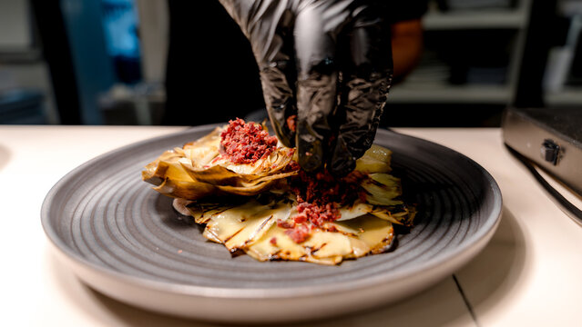 Chef preparing gourmet meal with fresh ingredients