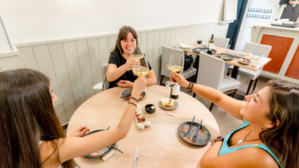 Friends enjoying a festive meal in a cozy restaurant
