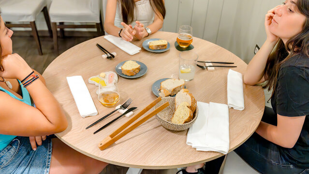 Friends enjoying a casual dinner at a cozy restaurant