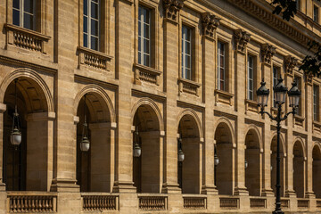 The elegant Stone Facade of the Grand Theatre Building in Bordeaux, France; Close-up with historical Street Lamp