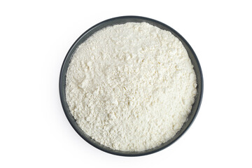 White flour in ceramic bowl isolated on white background. Top view. Flat lay.