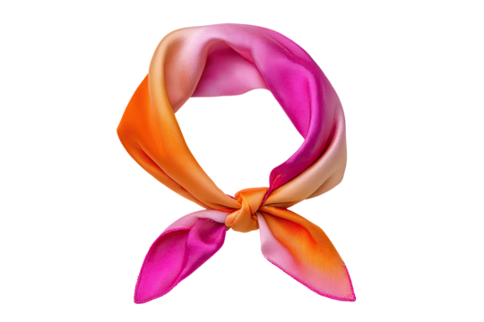 A vibrant silk scarf, ombre pink and orange, tied in a knot