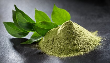 fresh gymnema sylvestre leaves and powder on dark surface