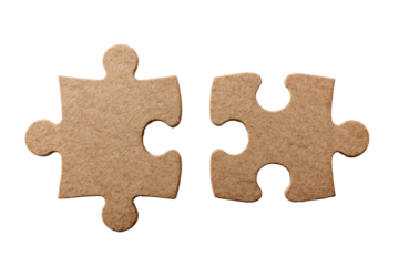 Two light brownish-tan puzzle pieces,  adjacent but separated,  against a black background.  The pieces are textured, like cardboard