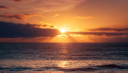 Naklejka premium scene serene beauty of sun sinking into ocean casting a golden glow and creating a peaceful atmosphere
