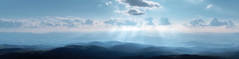 Fototapeta premium Serene mountain landscape with sunbeams and cloudy sky