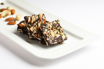 Home Made Dry Fruits Chocolate , served in white ceramic plate