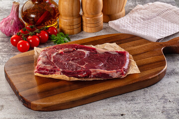 Gourmet raw rib eye steak