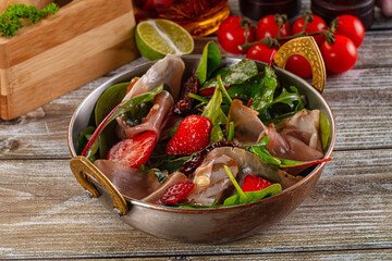 Salad with jamon, strawberry and arugula