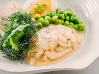 Aspic or Kholodets. Smoked carp aspic served with greens and pike caviar. Whiite chicken meat or fish in aspic with vegetables. Tasty fish in jelly. Fish or meat with gelatin. Delicious food close up