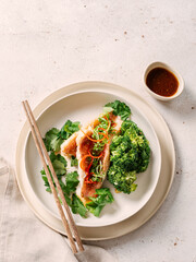 Captivating Capture: Exquisite Sea Bass with Broccoli in Asian style. Perfect Visual for Fish Food Menu Background. Delicious Baked Seabass with Broccoli And Sauce in Restaurant-style Plating. Topview