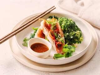 Captivating Capture: Exquisite Sea Bass with Broccoli in Asian style. Perfect Visual for Fish Food Menu Background. Delicious Baked Seabass with Broccoli And Sauce in Restaurant-style Plating