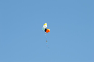 Colorful group of balloons against the blue sky