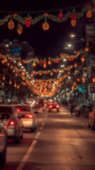 Blurred background of cars driving down street decorated with Christmas lights and festive ornaments, glowing garlands hanging above road, evening scene with warm colorful lighting.