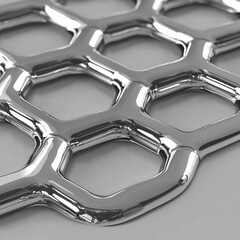Chrome honeycomb texture, close-up detail, metallic surface, gray background, industrial design