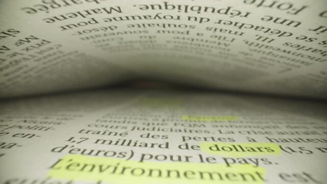 Close-Up of Folded Pages Inside Book with Emphasis on Typography