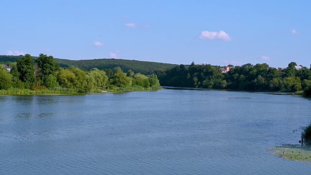 A calm river flows through the village