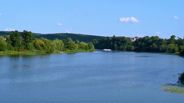 two men riding water scooters on a river