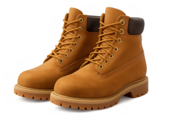 Classic yellow work boots with tied laces, isolated on transparent background, ready for your design projects