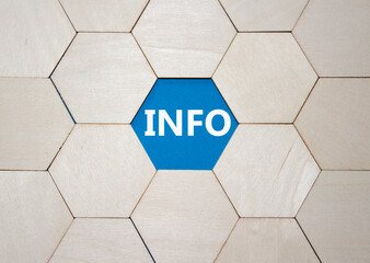 Info symbol. Concept word Info on wooden comb puzzle. Beautiful blue background. Business and Info concept. Copy space.