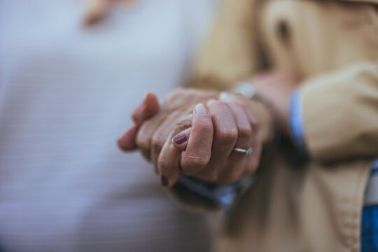 Close-Up of Elderly Hands Holding in a Gesture of Love and Support - Powered by Adobe