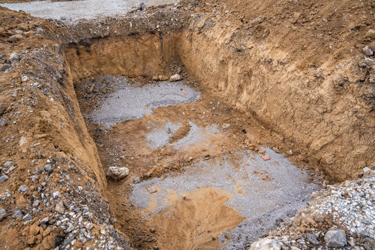 Plate load test results visible on soil surface after static pressure application. Ground investigation for foundation suitability and load-bearing capacity
