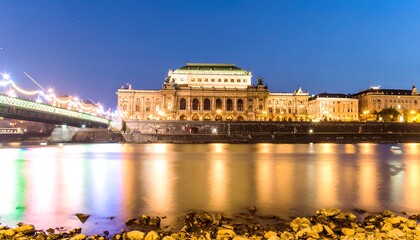 Night view of a grand opera house reflecting on the river