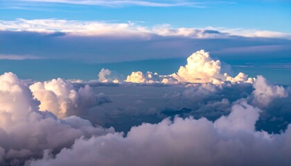 A vast expanse of cumulus clouds illuminated by golden sunlight