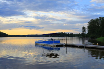 Obraz premium Landscape or seascape during the summer in July. Wooden bridge. Nora, Bergslagen, Sweden.
