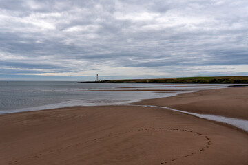 Grey clouds over the expansive beach at Montrose in Angus, Scotland
