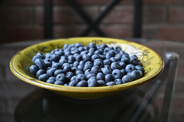Blueberries on a green plate close-up. Soft focus.