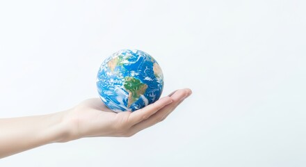 Hand Holding a Miniature Earth Globe
