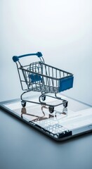 Miniature Shopping Cart on Digital Tablet Screen