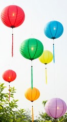 Obraz premium Colorful Paper Lanterns Illuminate a Bright Sky