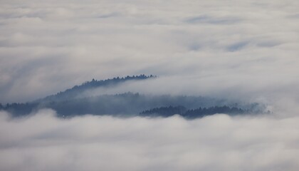 Mountain Range Amidst Clouds
