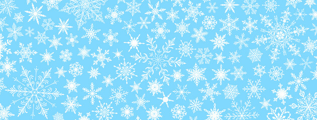 A vibrant Christmas illustration featuring various intricate snowflakes of varying sizes and designs, white on light blue background.