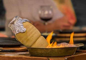 Testi kebab in a clay pot over flaming salt dish, restaurant in Istanbul, Turkey