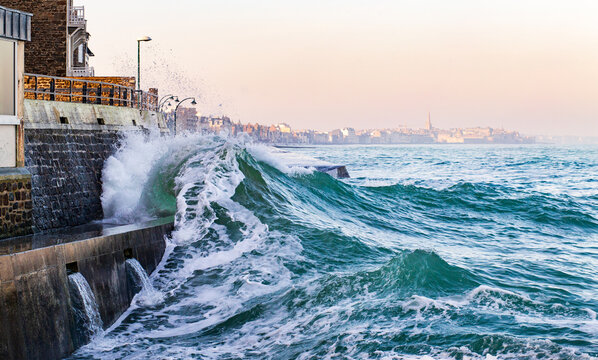 An impressive wave breaks over the sea wall in Saint-Malo