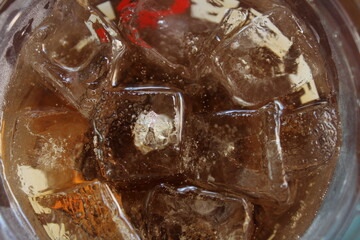 Close-Up of Ice Cubes and Cola Drink