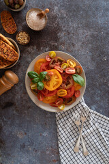 Colorful Sliced Tomatoes with Basil, Bread and Olives