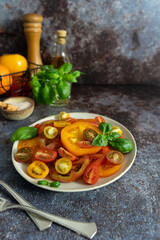 Colorful Tomatoes with Basil, Olive Oil and Seasonings