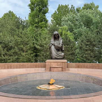 Statue of Crying Mother in front of the eternal fire in Tashkent, Uzbekistan 